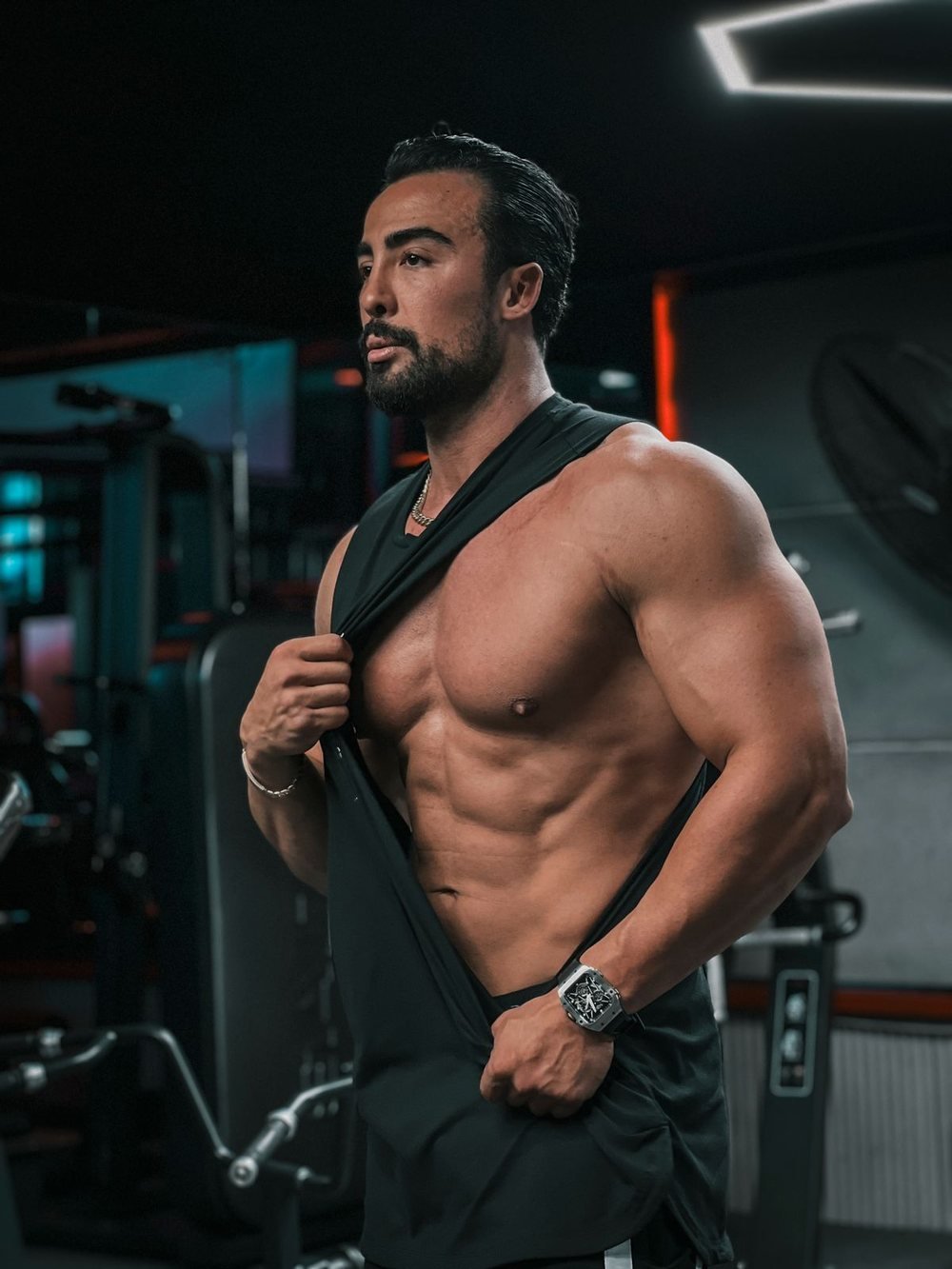 Muscular male personal trainer in a Singapore gym